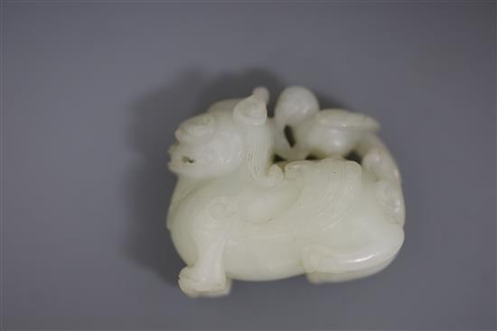 A Chinese white jade figure of bixi with a bird on its back, 17th/18th century, L. 5.4cm, wood stand